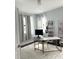 Home office with a large desk, window with curtains, and a plush rug at 1301 22Nd N Ave, St Petersburg, FL 33704