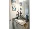 Bathroom with gray countertop, white cabinets and a single sink at 1301 22Nd N Ave, St Petersburg, FL 33704