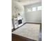 Dining room with hardwood floors, white rug, and a modern fireplace at 1301 22Nd N Ave, St Petersburg, FL 33704