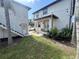 Spacious backyard with a grassy lawn, stairs, and exterior lighting at 1301 22Nd N Ave, St Petersburg, FL 33704