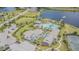 Aerial view of community clubhouse, pool, and tennis courts at 17705 Lucaya Dr, Bradenton, FL 34202