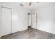 Bedroom with grey tile floors and double door closet at 18053 2Nd E St, Redington Shores, FL 33708