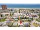 Aerial view of a house near the beach, with ocean and other properties visible at 18053 2Nd E St, Redington Shores, FL 33708