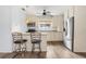 Kitchen with granite countertops, stainless steel appliances, and breakfast bar at 18053 2Nd E St, Redington Shores, FL 33708