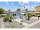 Single story home with landscaped yard and walkway at 18053 2Nd E St, Redington Shores, FL 33708