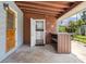 Covered back patio with exterior access to laundry at 18053 2Nd E St, Redington Shores, FL 33708