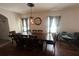 Bright dining room with wood table and chairs, ready for Gathering meals at 1006 Ashentree Dr, Plant City, FL 33563