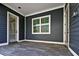 Covered back porch with tile flooring and windows at 3839 71St N St, St Petersburg, FL 33709