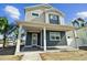 Two-story Craftsman style home with front porch and landscaping at 3839 71St N St, St Petersburg, FL 33709