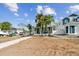 Two-story home with gray siding, walkway, and landscaping at 3839 71St N St, St Petersburg, FL 33709