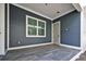 Covered back porch with tile flooring and windows at 3839 71St N St, St Petersburg, FL 33709