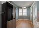 Modern kitchen with stainless steel refrigerator and light wood floors at 7974 Sailboat Key S Blvd # 504, South Pasadena, FL 33707