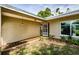 Inviting front entry with a tiled porch and decorative welcome sign at 11007 Hobson St, Spring Hill, FL 34608