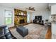 Living room features a stone fireplace and hardwood floors at 11007 Hobson St, Spring Hill, FL 34608