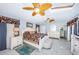 Bright bedroom featuring a king-size bed and built-in shelving at 2608 53Rd S St, Gulfport, FL 33707