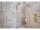 Large shower with tile surround and multiple shower heads at 2608 53Rd S St, Gulfport, FL 33707