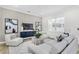 Comfortable living room with light gray seating and a neutral color scheme at 3839 71St N St, St Petersburg, FL 33709