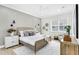 Bright bedroom with wood bed frame, neutral decor, and a window at 3839 71St N St, St Petersburg, FL 33709