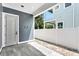 Private patio with gray tile and adjacent fence at 3839 71St N St, St Petersburg, FL 33709