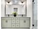 Elegant bathroom with double vanity and a large mirror at 3839 71St N St, St Petersburg, FL 33709