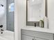 Modern bathroom with a gray vanity and subway tile shower at 3839 71St N St, St Petersburg, FL 33709