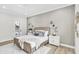 Main bedroom with light walls, and a large modern painting at 3839 71St N St, St Petersburg, FL 33709