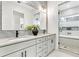 Spa-like bathroom with double vanity and walk-in shower at 3839 71St N St, St Petersburg, FL 33709