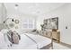 Primary bedroom with large bed, light walls, and stylish dresser at 3839 71St N St, St Petersburg, FL 33709