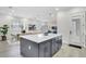 Modern kitchen with navy blue cabinetry, white quartz island, and stainless steel appliances at 3839 71St N St, St Petersburg, FL 33709