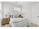 Bright bedroom with a cozy bed, wooden nightstands, and a neutral color scheme at 3839 71St N St, St Petersburg, FL 33709