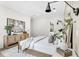 Main bedroom with light walls, and a large modern painting at 3839 71St N St, St Petersburg, FL 33709
