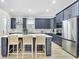 Modern kitchen with navy blue cabinetry, white quartz countertops and island at 3839 71St N St, St Petersburg, FL 33709