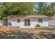 Back exterior view of the home with a private patio at 135 Se Monroe N Cir, St Petersburg, FL 33703