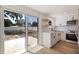 Modern kitchen with sliding door access to backyard patio at 135 Se Monroe N Cir, St Petersburg, FL 33703