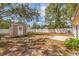 Backyard with storage shed and fenced area at 135 Se Monroe N Cir, St Petersburg, FL 33703