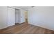 Simple bedroom with wood-look flooring and a closet at 135 Se Monroe N Cir, St Petersburg, FL 33703