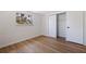 Bright bedroom with walk-in closet and wood-look flooring at 135 Se Monroe N Cir, St Petersburg, FL 33703
