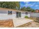 Private backyard patio with sliding glass door access at 135 Se Monroe N Cir, St Petersburg, FL 33703