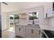 Modern kitchen with stainless steel appliances and white cabinetry at 135 Se Monroe N Cir, St Petersburg, FL 33703