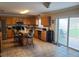 Kitchen with island, stainless steel appliances, and sliding door to patio at 2719 Mingo Dr, Land O Lakes, FL 34638
