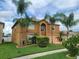 Two story house with palm trees and driveway at 2719 Mingo Dr, Land O Lakes, FL 34638