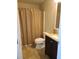 Bathroom with tub shower, toilet and vanity at 2719 Mingo Dr, Land O Lakes, FL 34638
