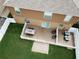 Backyard features a deck, grassy area, and AC units at 2719 Mingo Dr, Land O Lakes, FL 34638