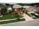 Two-story house with driveway and street view at 2719 Mingo Dr, Land O Lakes, FL 34638