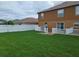 Large backyard with a deck and privacy fence at 2719 Mingo Dr, Land O Lakes, FL 34638