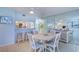 Charming dining area with round table and coastal-themed decor at 3500 Gulf Blvd # 408, Belleair Beach, FL 33786