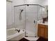 Modern bathroom boasts a glass-enclosed shower, soaking tub, and wood vanity at 22531 Eagles Watch Dr, Land O Lakes, FL 34639