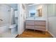 Bathroom with a shower/tub combo, single vanity, and tiled floor at 9 Haig Pl # 312, Dunedin, FL 34698