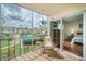 Screened balcony overlooking the community pool and surrounding area at 8693 Bardmoor Blvd # 202B, Seminole, FL 33777