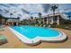 Inviting community pool with surrounding lounge chairs at 8693 Bardmoor Blvd # 202B, Seminole, FL 33777